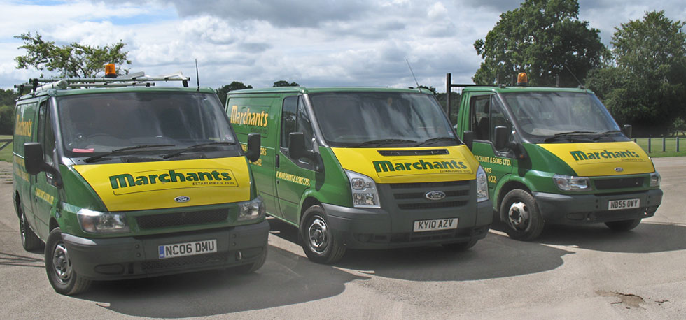 A row of three company vans