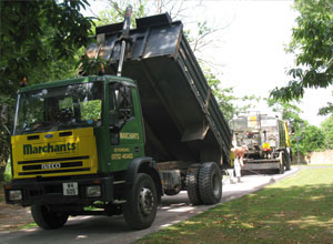 Tipper with man working 